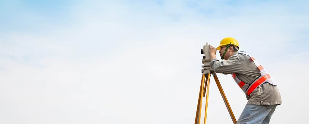 Engineering-student-surveying-land.