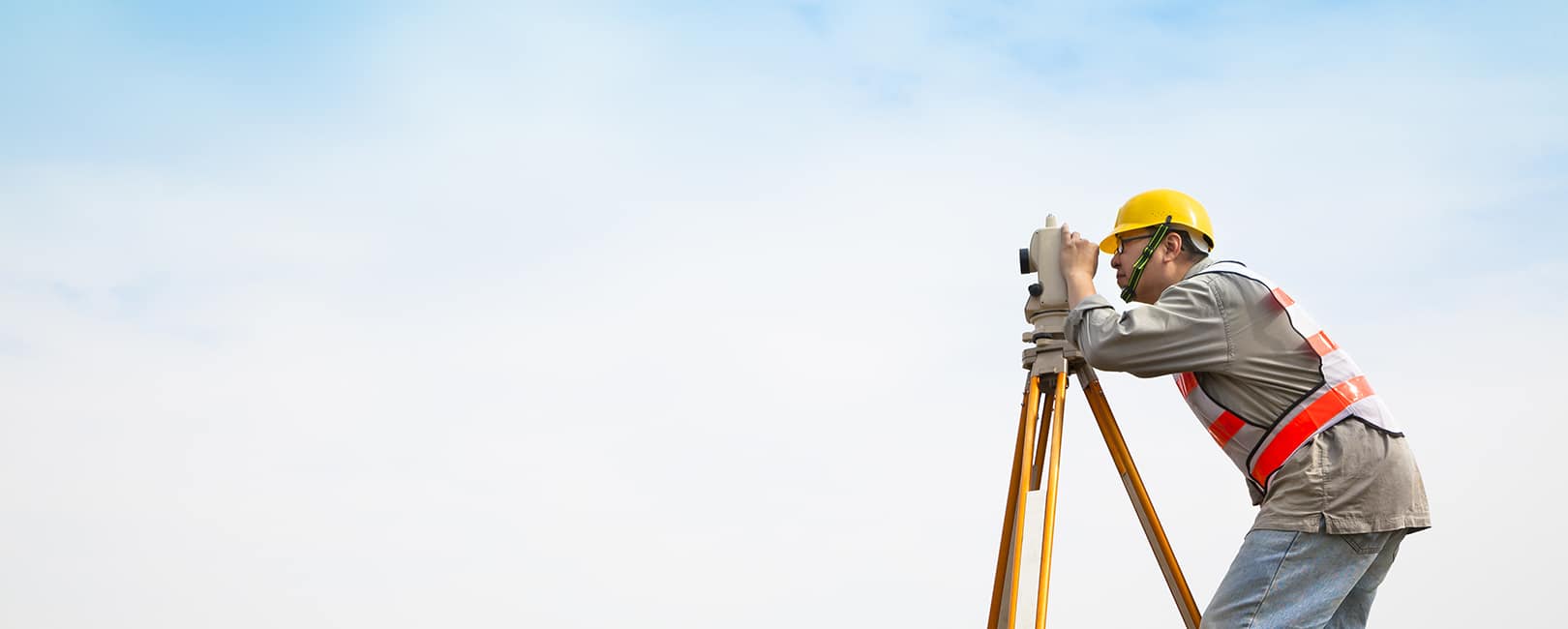 Engineering-student-surveying-land.