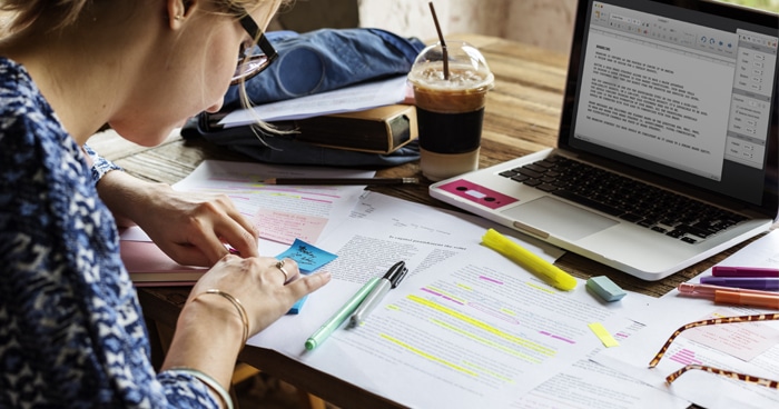 a-stock-photo-of-a-woman-working-at-her-desk