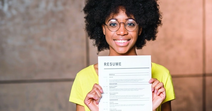 a-stock-photo-of-a-woman-holding-her-resume