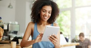 a-stock-photo-of-a-woman-browsing-her-tablet