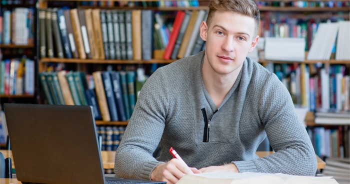 a-stock-photo-of-a-man-at-a-desk-with-a-laptop