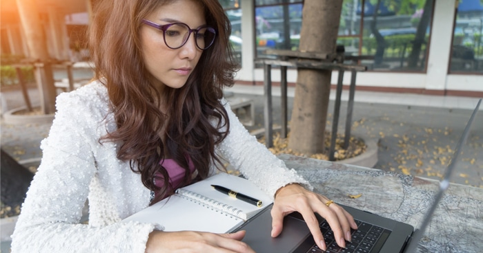 a-stock-photo-of-a-woman-typing-on-a-laptop