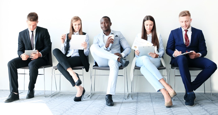 a-stock-photo-of-a-group-of-business-men-and-women-sitting-together