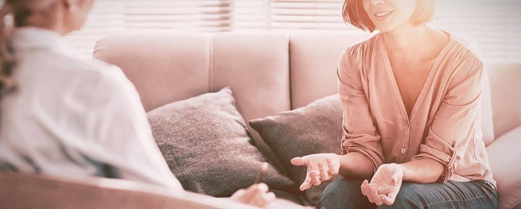 Therapist-talking-to-client.