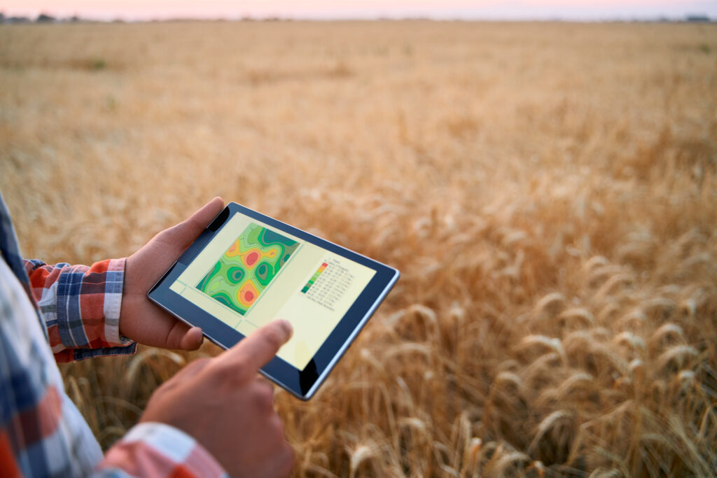 a-stock-photo-of-a-man-in-a-field-with-a-tablet